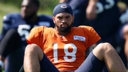 Chicago Bears quarterback Caleb Williams (18) sits on the field during joint training camp practice with the Miami Dolphins ahead of Sunday's preseason opener.