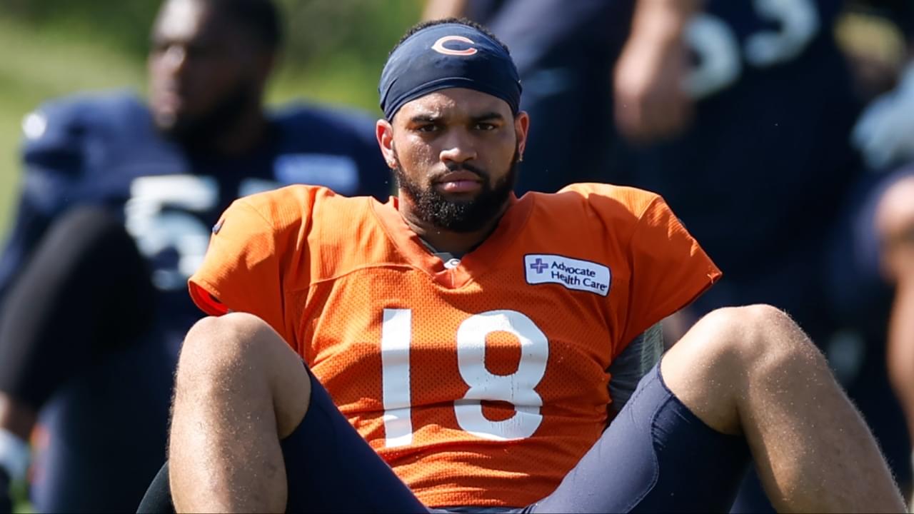 Chicago Bears quarterback Caleb Williams (18) sits on the field during joint training camp practice with the Miami Dolphins ahead of Sunday's preseason opener.