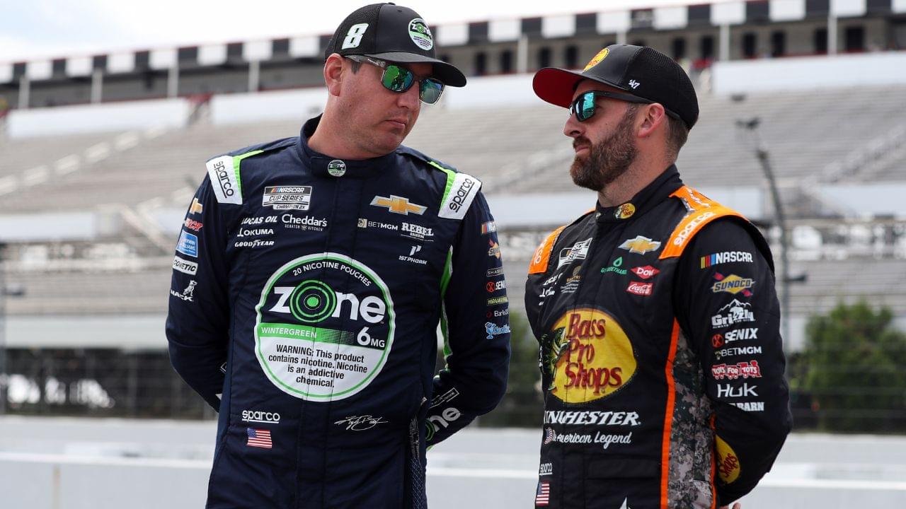 NASCAR Cup Series driver Kyle Busch (left) talks with driver Austin Dillon (right) on pit road during practice and qualifying for The Great American Getaway 400 at Pocono Raceway.