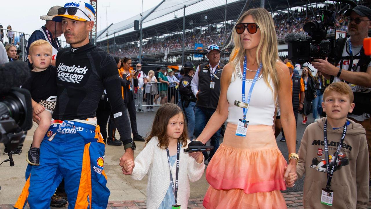Indycar Series driver Kyle Larson holds son Cooper Larson as he walks with daughter Audrey Larson, wife Katelyn Larson and son Owen Larson prior to the 108th running of the Indianapolis 500 at Indianapolis Motor Speedway.