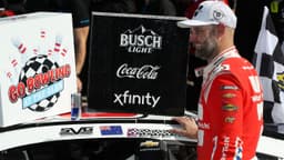 NASCAR Cup Series driver Shane Van Gisbergen applies the winner’s sticker to his car in victory lane after winning the Go Bowling at The Glen at Watkins Glen International.