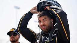 Bubba Wallace (23) puts on his helmet during NASCAR Cup Series qualifying on Aug. 2, 2025, at Iowa Speedway in Newton, Iowa.