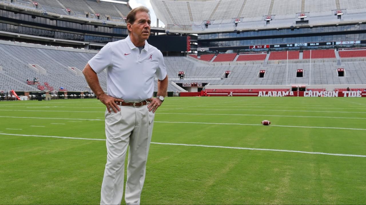 Alabama football coach Nick Saban stands on the turf inside Bryant-Denny Stadium during his team's media day in 2019.