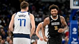 Memphis Grizzlies guard Marcus Smart (36) smiles after scoring against Dallas Mavericks guard Luka Doncic (77) during the first quarter at the American Airlines Center.