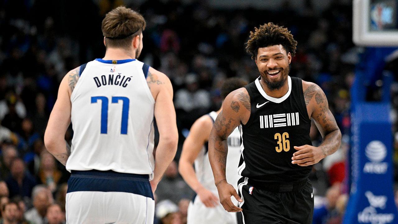 Memphis Grizzlies guard Marcus Smart (36) smiles after scoring against Dallas Mavericks guard Luka Doncic (77) during the first quarter at the American Airlines Center.