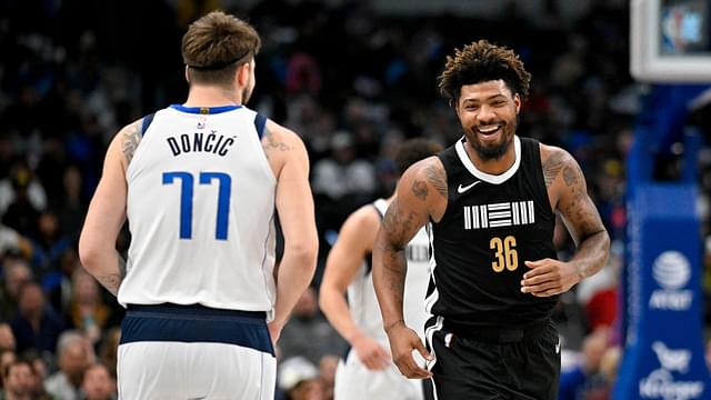 Memphis Grizzlies guard Marcus Smart (36) smiles after scoring against Dallas Mavericks guard Luka Doncic (77) during the first quarter at the American Airlines Center.
