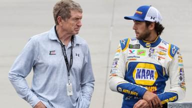 NASCAR Cup Series driver Chase Elliott (right) stands with his father and former driver Bill Elliott (left) prior to the AAA Drive for Autism at Dover International Speedway.