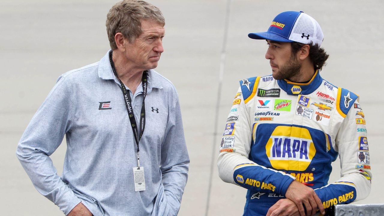 NASCAR Cup Series driver Chase Elliott (right) stands with his father and former driver Bill Elliott (left) prior to the AAA Drive for Autism at Dover International Speedway.