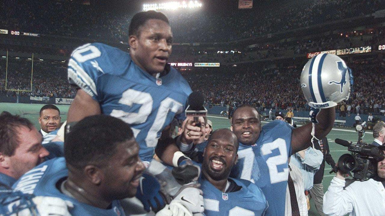 Detroit Lions running back Barry Sanders is carried on the shoulders of teammates after reaching the 2,000-yard milestone in 1997.