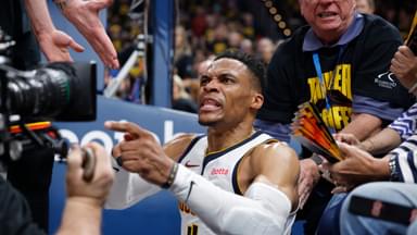 Denver Nuggets guard Russell Westbrook (4) reacts after a play and falling into fans in the second quarter against the Oklahoma City Thunder during game two of the second round for the 2025 NBA Playoffs at Paycom Center.