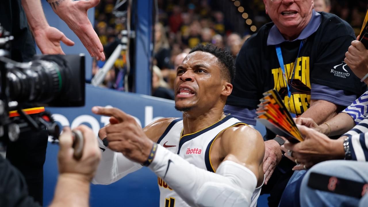 Denver Nuggets guard Russell Westbrook (4) reacts after a play and falling into fans in the second quarter against the Oklahoma City Thunder during game two of the second round for the 2025 NBA Playoffs at Paycom Center.