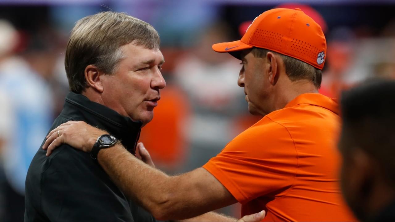 Georgia coach Kirby Smart and Clemson head coach Dabo Swinney speak before the start of the NCAA Aflac Kickoff Game in Atlanta, on Saturday, Aug. 31, 2024.