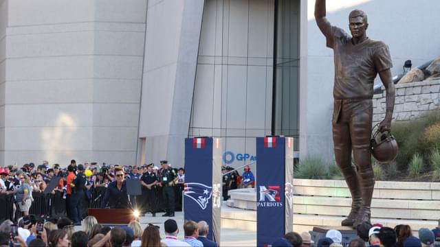 Retired New England Patriot Hall of Famer Tom Brady speaks during a statue unveiling before a game against the Washington Commanders at Gillette Stadium.