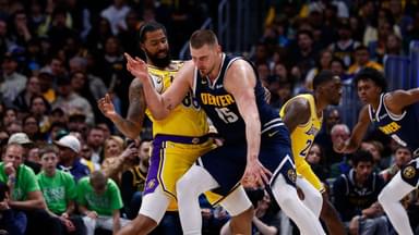 Denver Nuggets center Nikola Jokic (15) controls the ball as Los Angeles Lakers forward Markieff Morris (88) guards in the third quarter at Ball Arena.