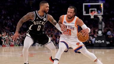 New York Knicks guard Jalen Brunson (11) controls the ball against Milwaukee Bucks guard Damian Lillard (0) during the first quarter at Madison Square Garden