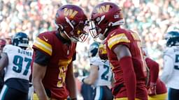 Washington Commanders quarterback Jayden Daniels (5) celebrates with Commanders wide receiver Terry McLaurin (17) after connecting on a touchdown pass against the Philadelphia Eagles during the second quarter at Northwest Stadium.