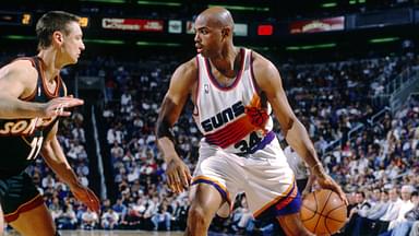 Phoenix Suns forward Charles Barkley (34) is defended by Seattle Supersonics forward Detlef Schrempf (11) at America West Arena.