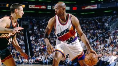 Phoenix Suns forward Charles Barkley (34) is defended by Seattle Supersonics forward Detlef Schrempf (11) at America West Arena.