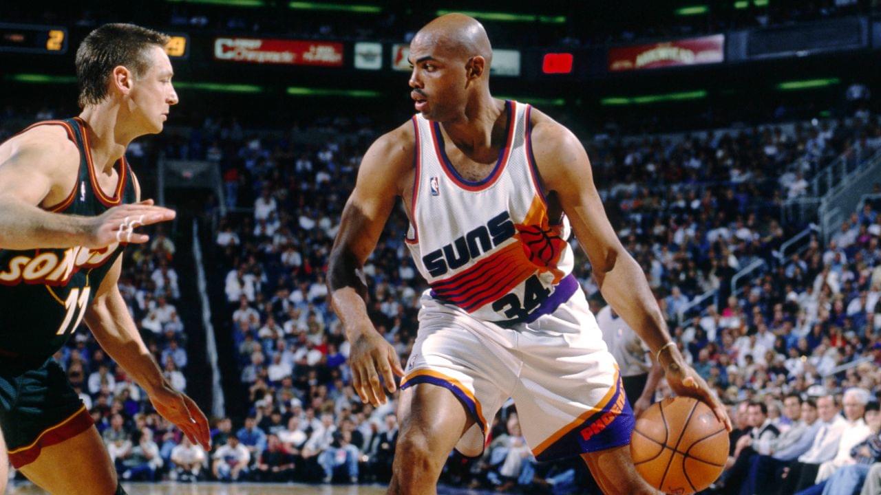 Phoenix Suns forward Charles Barkley (34) is defended by Seattle Supersonics forward Detlef Schrempf (11) at America West Arena.