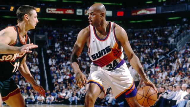 Phoenix Suns forward Charles Barkley (34) is defended by Seattle Supersonics forward Detlef Schrempf (11) at America West Arena.