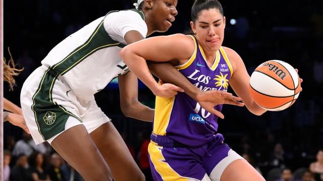 Los Angeles Sparks guard Kelsey Plum (10) drives to the basket defended by Seattle Storm forward Ezi Magbegor (13) during the second quarter at Crypto.com Arena.