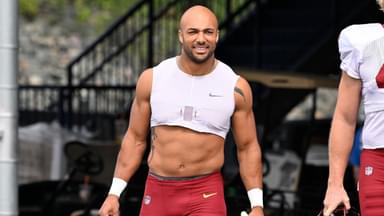Washington Commanders running back Austin Ekeler (30) arrives at training camp at Gillette Stadium.