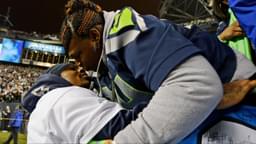 Seattle Seahawks running back Marshawn Lynch (left) kisses his mother Delisa Lynch (right) after the 2013 NFC Championship football game against the San Francisco 49ers at CenturyLink Field.