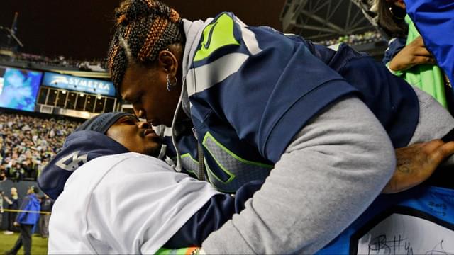 Seattle Seahawks running back Marshawn Lynch (left) kisses his mother Delisa Lynch (right) after the 2013 NFC Championship football game against the San Francisco 49ers at CenturyLink Field.