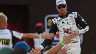 NASCAR Cup Series driver William Byron (24) shakes hands with fans during driver introductions prior to the NASCAR Cup Series Cook Out 400 at Richmond Raceway.