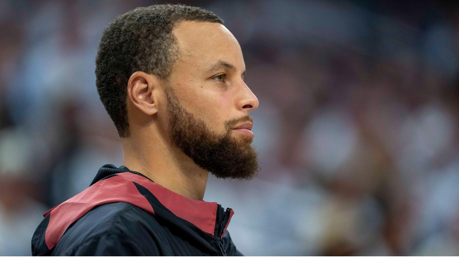 May 8, 2025; Minneapolis, Minnesota, USA; Golden State Warriors guard Stephen Curry (30) looks on from the bench against the Minnesota Timberwolves in the second half during game two of the second round for the 2025 NBA Playoffs at Target Center