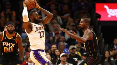 Nov 26, 2024; Phoenix, Arizona, USA; Los Angeles Lakers forward LeBron James (23) against Phoenix Suns forward Kevin Durant (35) during an NBA Cup game at Footprint Center.