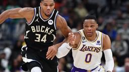 Dec 2, 2022; Milwaukee, Wisconsin, USA; Milwaukee Bucks forward Giannis Antetokounmpo (34) races down the court with Los Angeles Lakers guard Russell Westbrook (0) at Fiserv Forum.