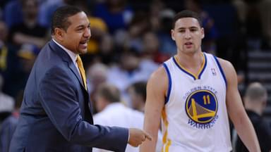 Golden State Warriors head coach Mark Jackson (left) instructs in front of shooting guard Klay Thompson (11) against the Denver Nuggets during the first quarter at Oracle Arena.