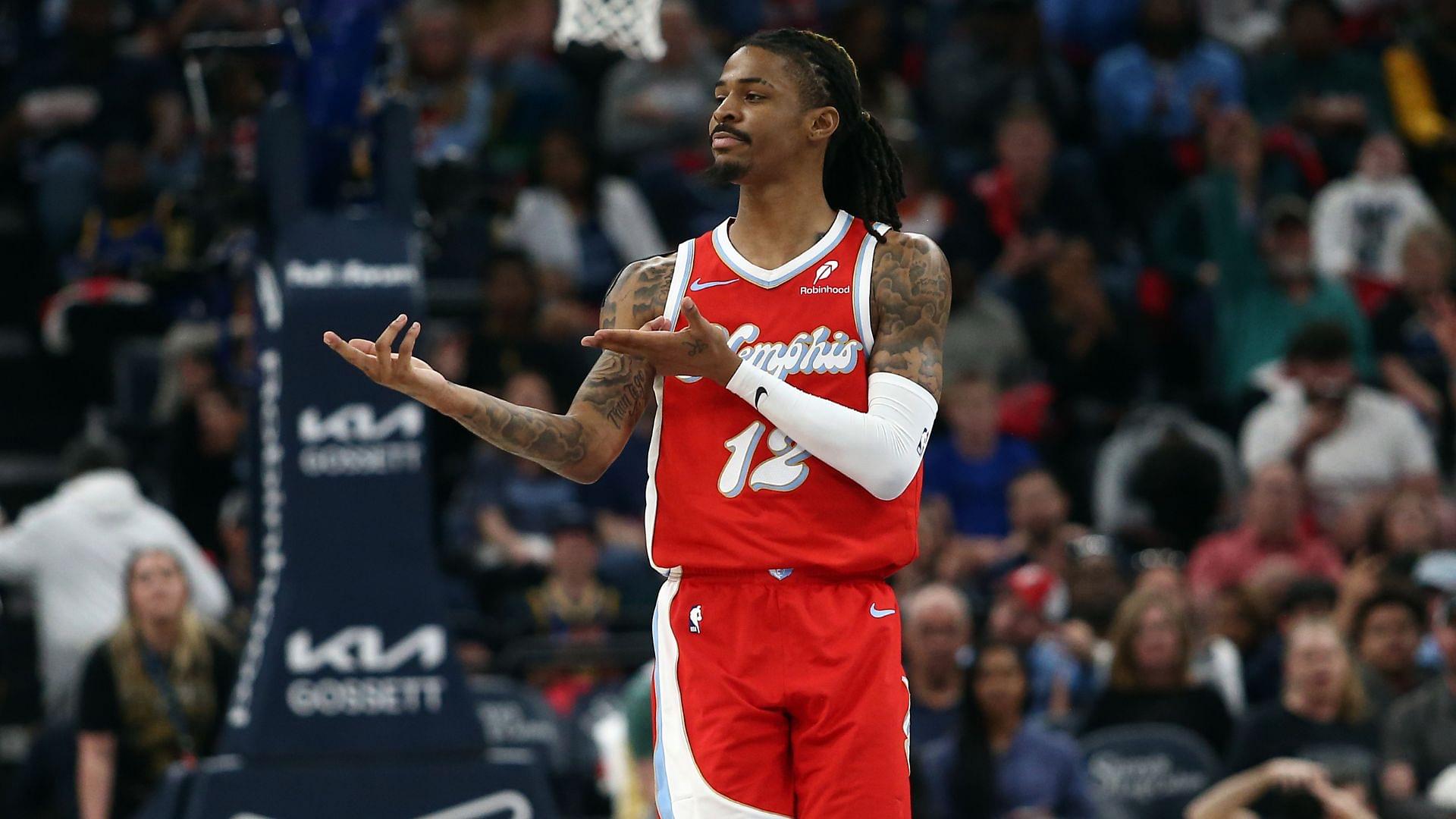 Apr 1, 2025; Memphis, Tennessee, USA; Memphis Grizzlies guard Ja Morant (12) reacts after a basket during the second quarter against the Golden State Warriors at FedExForum.