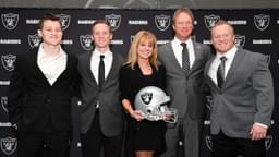 Jon Gruden and wife Cindy Gruden pose with sons Deuce Gruden, Michael Gruden and Jon Gruden III pose at press conference after being introduced as Oakland Raiders head coach at the Raiders headquarters.