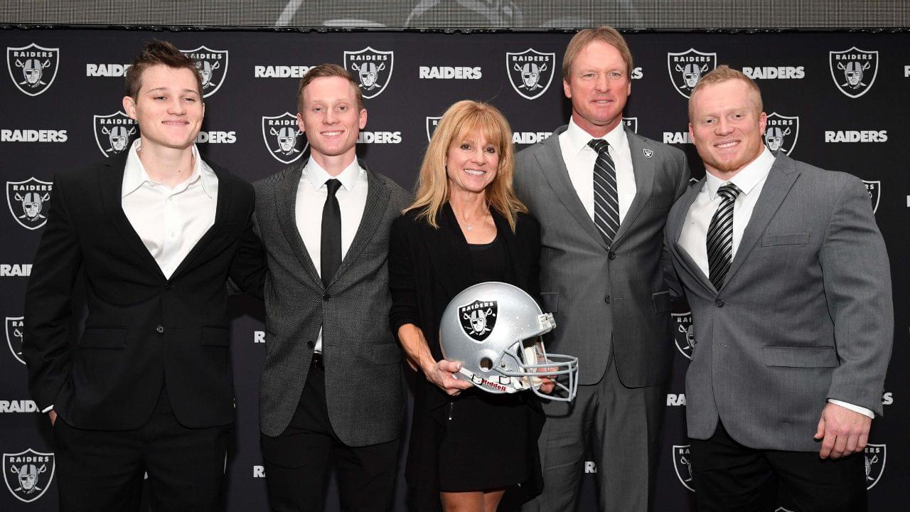 Jon Gruden and wife Cindy Gruden pose with sons Deuce Gruden, Michael Gruden and Jon Gruden III pose at press conference after being introduced as Oakland Raiders head coach at the Raiders headquarters.