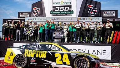 William Byron (24), crew members and sponsors pose for pictures after the NASCAR Cup Series Iowa Corn 350 on Aug. 3, 2025, at Iowa Speedway in Newton, Iowa. Byron (24) finished the race first.