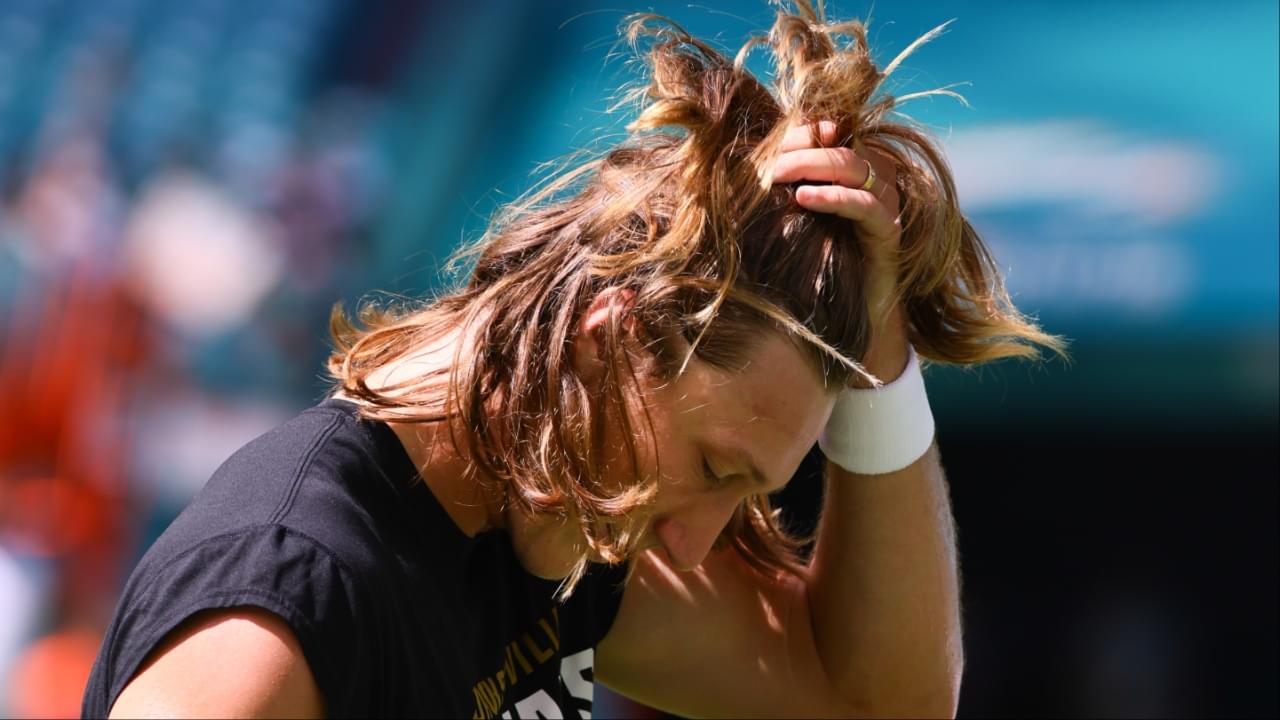 Jacksonville Jaguars quarterback Trevor Lawrence (16) runs hand through his hair before the game against the Miami Dolphins at Hard Rock Stadium.