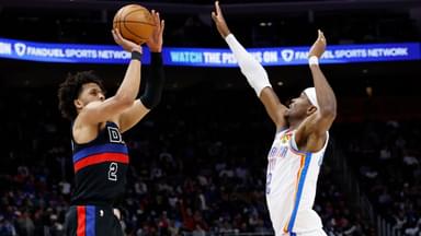 Detroit Pistons guard Cade Cunningham (2) shoots on Oklahoma City Thunder guard Shai Gilgeous-Alexander (2) in the first half at Little Caesars Arena.
