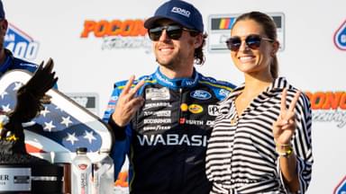 Team Penske's Ryan Blaney (12) poses with his fiancé Gianna Tulio on July 14, 2024