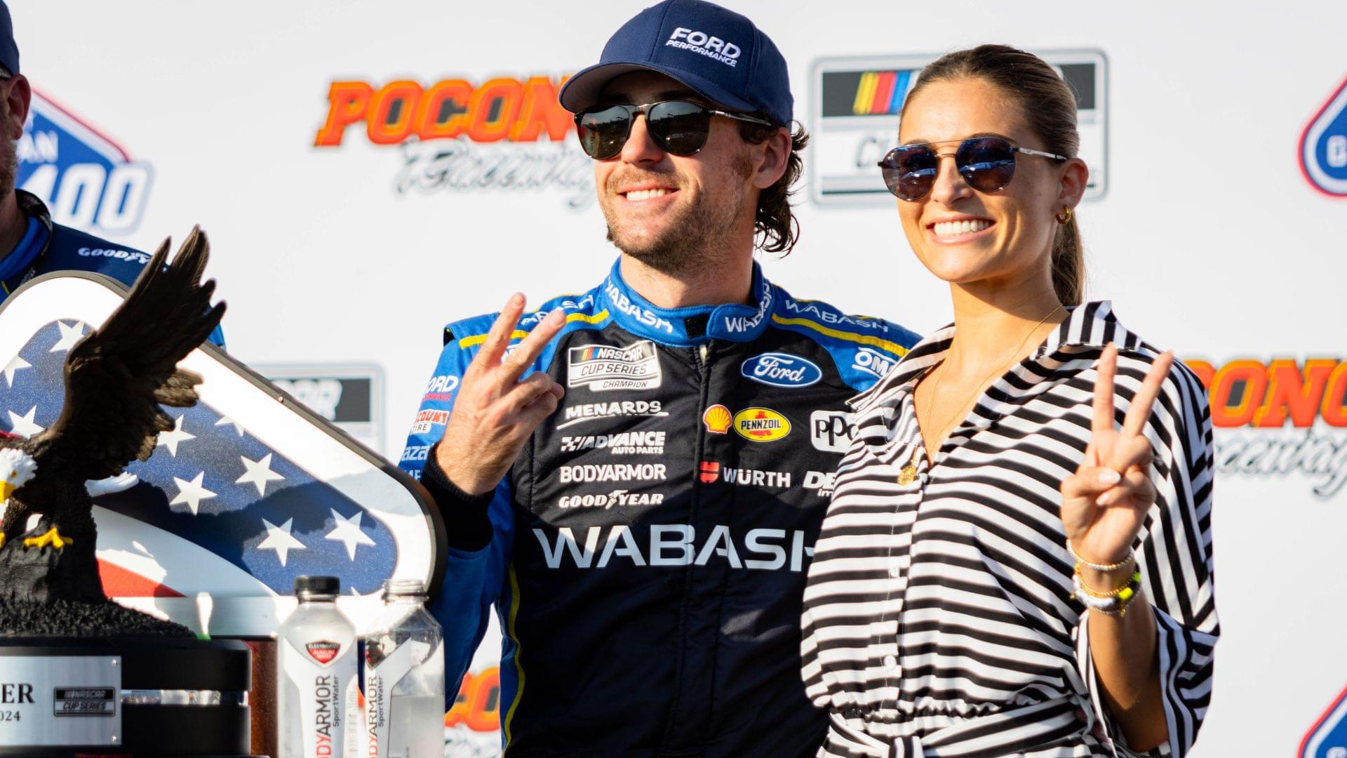 Team Penske's Ryan Blaney (12) poses with his fiancé Gianna Tulio on July 14, 2024