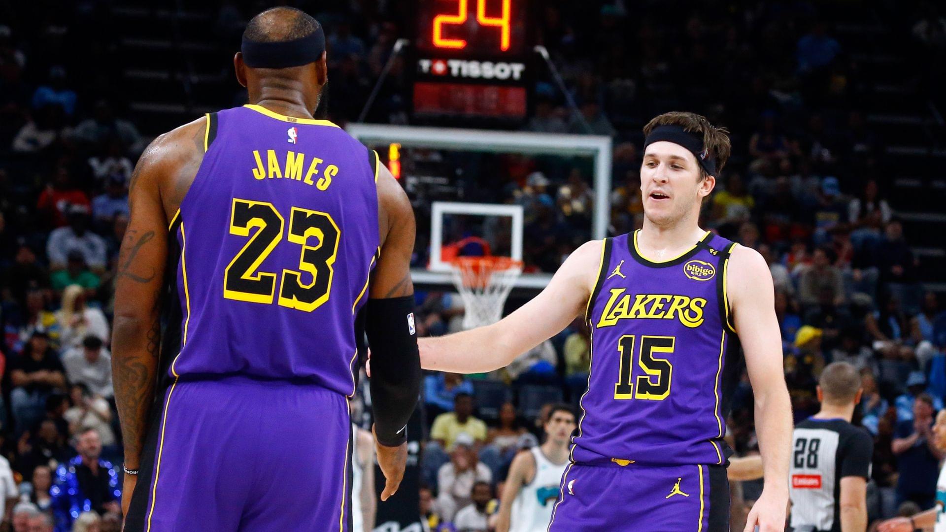 Mar 29, 2025; Memphis, Tennessee, USA; Los Angeles Lakers guard Austin Reaves (15) reacts with forward LeBron James (23) during the second quarter against the Memphis Grizzlies at FedExForum