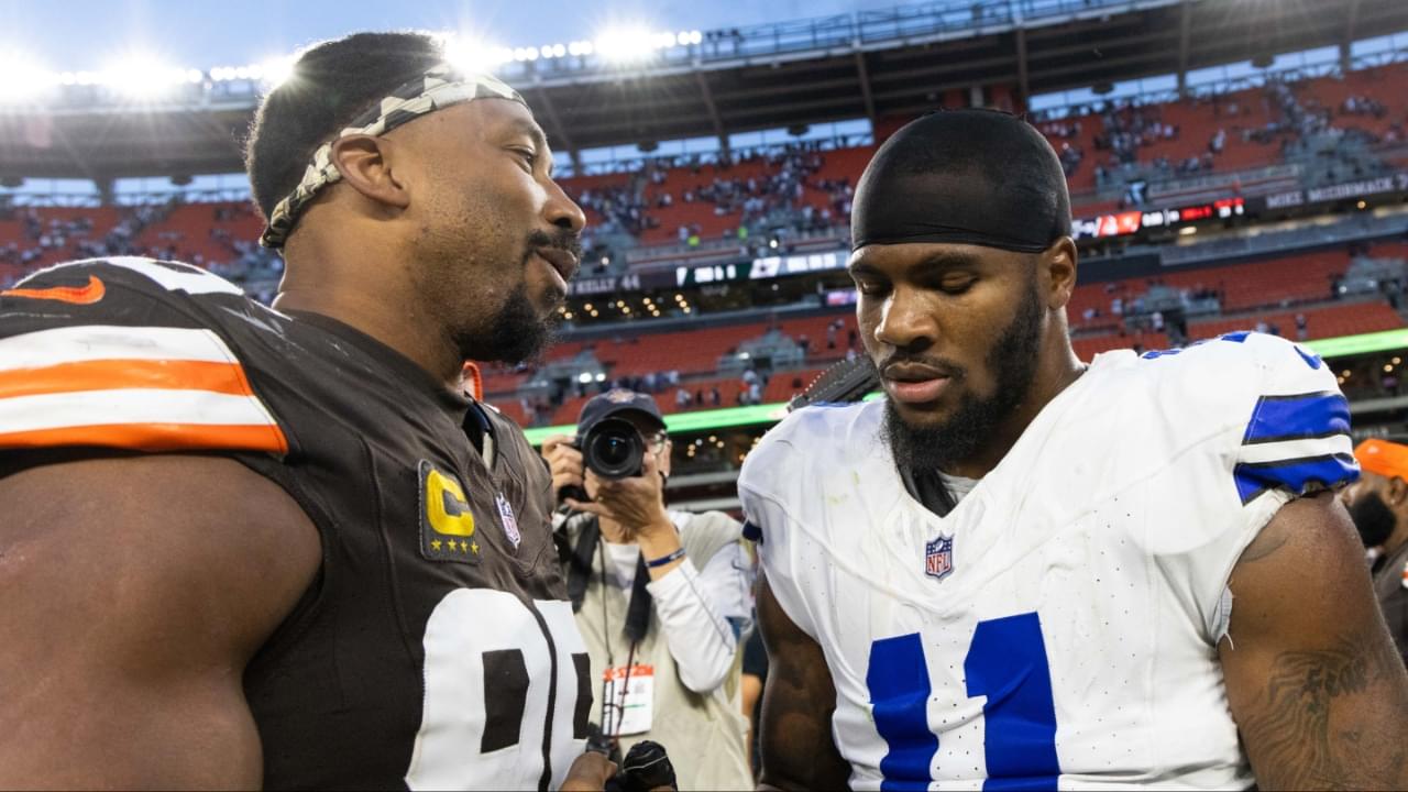 Cleveland Browns defensive end Myles Garrett (95) congratulates Dallas Cowboys linebacker Micah Parsons (11) after the game at Huntington Bank Field.