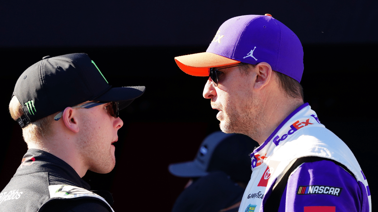 Feb 19, 2024; Daytona Beach, Florida, USA; NASCAR Cup Series driver Denny Hamlin (11) and driver Ty Gibbs (54) talk during driver introductions before the Daytona 500 at Daytona International Speedway. Mandatory Credit: John David Mercer-Imagn Images