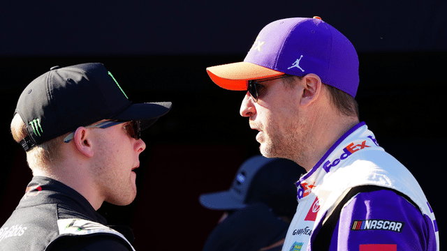 Feb 19, 2024; Daytona Beach, Florida, USA; NASCAR Cup Series driver Denny Hamlin (11) and driver Ty Gibbs (54) talk during driver introductions before the Daytona 500 at Daytona International Speedway. Mandatory Credit: John David Mercer-Imagn Images