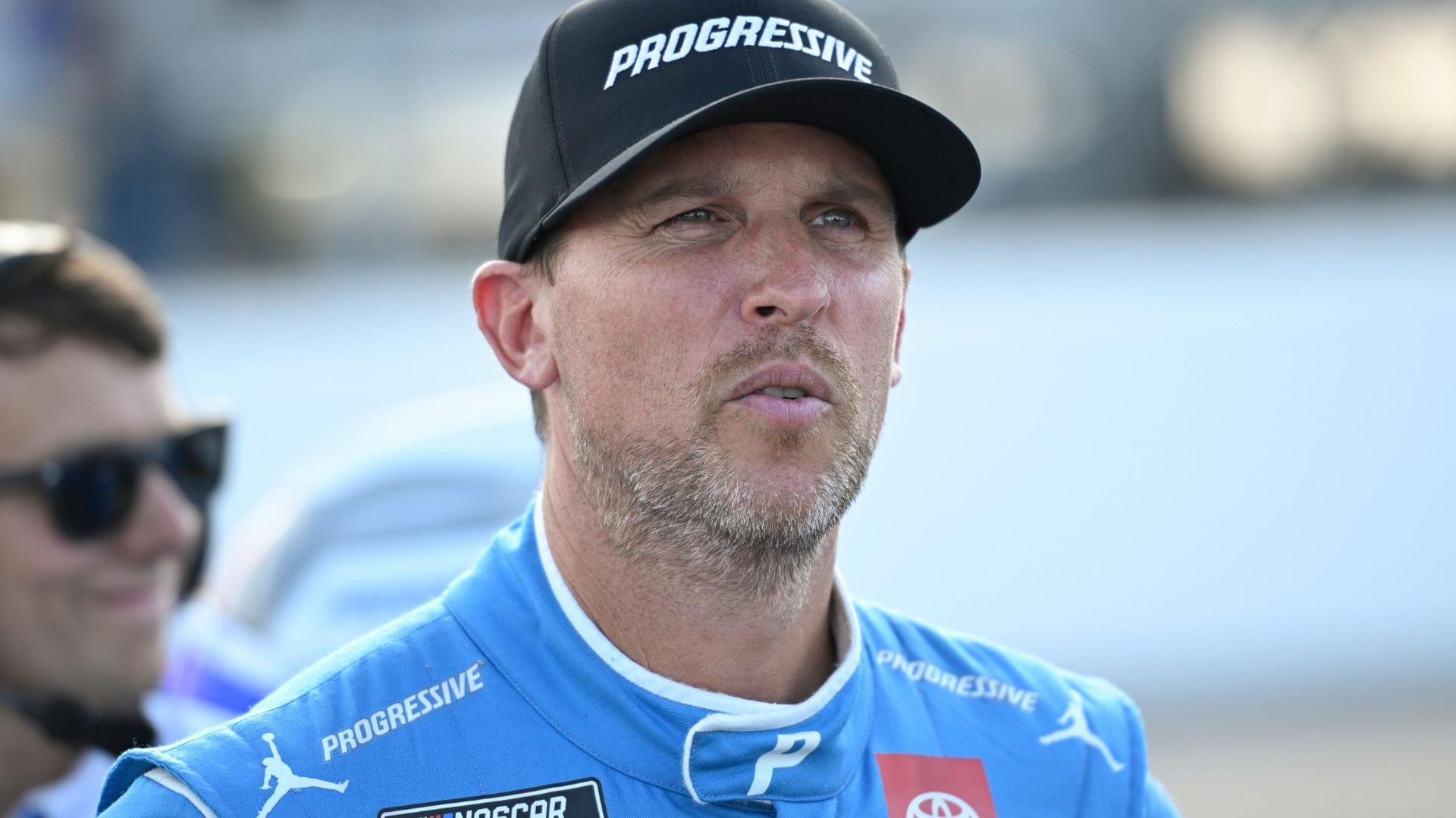 Sep 6, 2025; Madison, Illinois, USA; NASCAR Cup Series driver Denny Hamlin (11) looks on during practice and qualifying for the Enjoy Illinois 300 at World Wide Technology Raceway