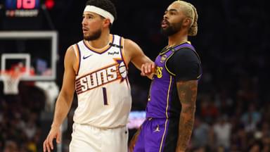 Oct 28, 2024; Phoenix, Arizona, USA; Los Angeles Lakers guard D'Angelo Russell (right) against Phoenix Suns guard Devin Booker at Footprint Center.