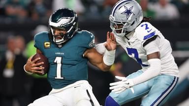 Dallas Cowboys cornerback Trevon Diggs (7) tackles Philadelphia Eagles quarterback Jalen Hurts (1) during the third quarter of the game at Lincoln Financial Field.