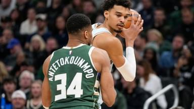 Jan 8, 2025; Milwaukee, Wisconsin, USA; San Antonio Spurs forward Victor Wembanyama (1) holds the ball away from Milwaukee Bucks forward Giannis Antetokounmpo (34) during the second quarter at Fiserv Forum.
