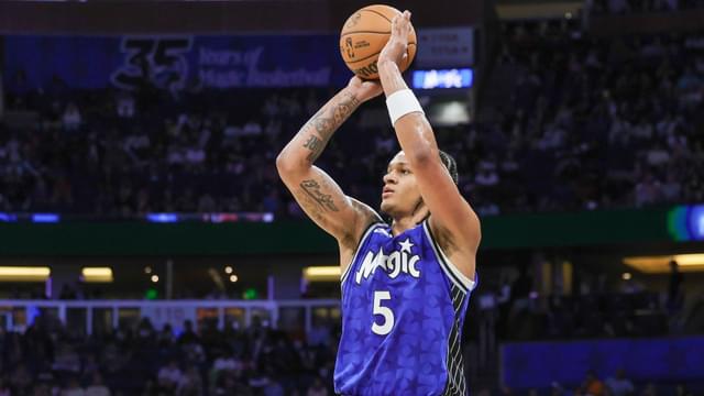 Mar 30, 2024; Orlando, Florida, USA; Orlando Magic forward Paolo Banchero (5) shoots a three point basket during the second quarter against the Memphis Grizzlies at KIA Center.